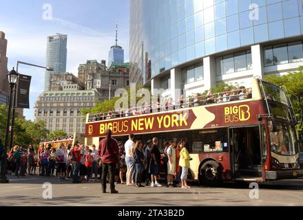 New York, USA - May 30, 2018: Tourists near Big Bus New York Hop-On Hop-Off Bus Tour in New York. Stock Photo