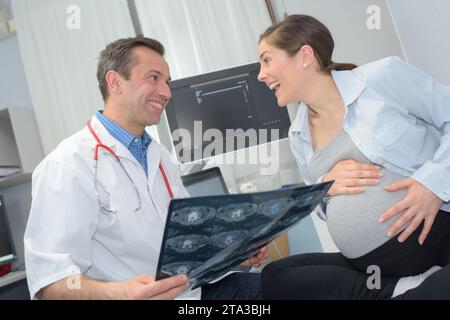 happy pregnant woman after cardiotocography Stock Photo