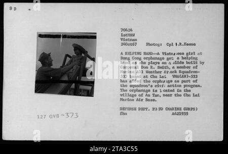 A Vietnamese girl at the Dong Cong orphanage plays on a slide built by ...