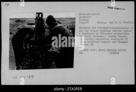 - Marines from the 1st 8-inch Howitzer Battery unloading a truckload of 200-pound projectiles for their howitzer in Vietnam. - In August, the battery destroyed 19 enemy artillery weapons and damaged 25. - Photograph taken on September 3, 1968, by Cpl. R. I. Brumfiel. - Department of Defense photo (Marine Corps). Stock Photo