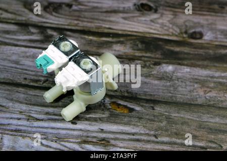 A broken and a new inlet water valves of automatic electric washing ...