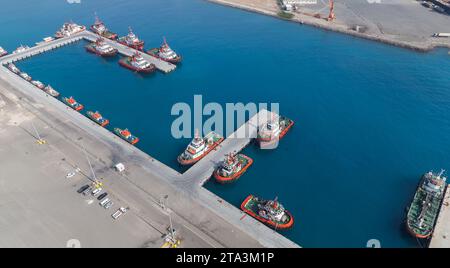 Fleet of tug boats and Pilot boats of Jeddah Islamic Seaport, aerial view taken on a sunny day Stock Photo