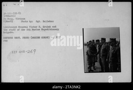 Lieutenant General Victor H. Krulak and the staff of the 9th Marine Expeditionary Brigade photographed in Da-Hang, Vietnam on March 23, 1965. They are seen discussing military activities with Robert McNamara, Richard Nixon, and Billy Graham. This image captures high-ranking officials and officers engaged in strategic planning during the Vietnam War. (Source: Defense Dept. Photo - Marthe Corps A183837) Stock Photo