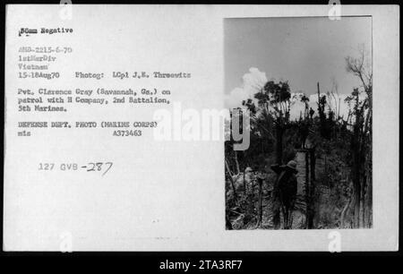 Pvt. Clarence Gray from Savannah, Ga. on patrol with H Company, 2nd Battalion, 5th Marines. The photograph was taken on August 15, 1970 during the Vietnam War. This image captures a moment of military activities, specifically patrolling, carried out by the American military forces in Vietnam. Stock Photo