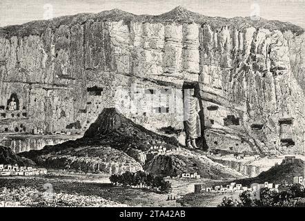 The Buddhas of Bamiyan, 6th-century monumental statues carved into the side of a cliff in the Bamyan valley of central Afghanistan. Old illustration from La Nature 1887 Stock Photo