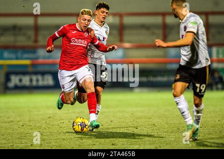 Morecambe's Joel Senior under pressure from Newport's Seb Palmer ...