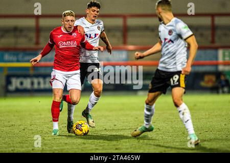 Morecambe's Joel Senior under pressure from Newport's Seb Palmer ...