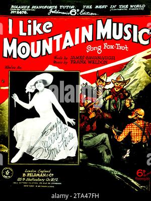 Energetic Vintage Sheet Music - 'I Like Mountain Music'. 1930s sheet music cover with dancing figure and mountain musicians illustration. Stock Photo