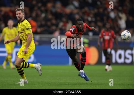 Milan, Italy. 28th Nov, 2023. Niclas Fullkrug of Borussia Dortmund and Fikayo Tomori of AC Milan during the UEFA Champions League match at Giuseppe Meazza, Milan. Picture credit should read: Jonathan Moscrop/Sportimage Credit: Sportimage Ltd/Alamy Live News Stock Photo