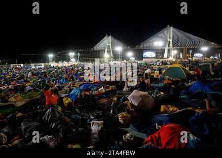 Young people sleeping at night in Parque Tejo – Campo da Graça. World Youth Days 2023 in Lisbon, Portugal. Stock Photo