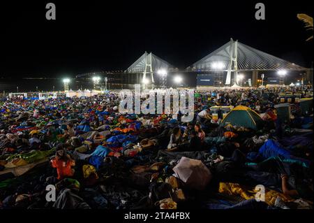 Young people sleeping at night in Parque Tejo – Campo da Graça. World Youth Days 2023 in Lisbon, Portugal. Stock Photo