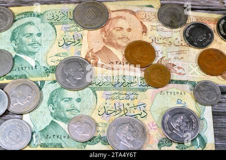 Jordanian money background of old coins and banknotes of Dinars of old times, old vintage retro Jordan money coin and bills, exchange rate, economy st Stock Photo