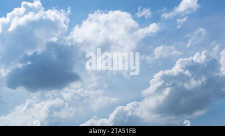 Blue sky with fluffy clouds Stock Photo