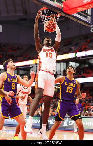 Syracuse, New York, USA. 28th Nov, 2023. During the ACC/SEC challenge game between Syracuse University and LSU, Syracuse center NAHEEM MCLEOD (10) dunks the ball over LSU players forward WILL BAKER (9) and forward JALEN REED (13) during the first half at the JMA Wireless Dome on November 28, 2023, in Syracuse, NY. (Credit Image: © Scott Rausenberger/ZUMA Press Wire) EDITORIAL USAGE ONLY! Not for Commercial USAGE! Stock Photo