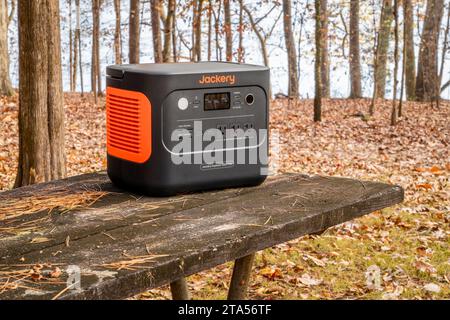 Colbert Ferry Park, AL, USA - November 23, 2023: Jackery Explorer 1000 Plus Portable Power Station on a picnic table on a shore of Tennessee River. Stock Photo