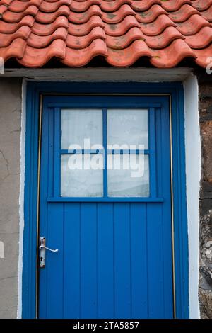 Blue painted cottage door in Crovie. Aberdeenshire, Scotland Stock Photo