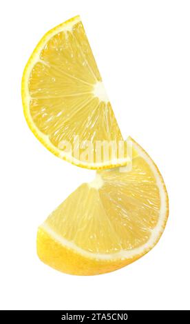 hanging, falling and flying piece of lemon fruits isolated on white background with clipping path Stock Photo