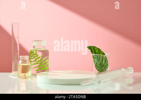 Pink background featured a podium with blank space and some glassware. Concept laboratory tests and research natural extract making cosmetics Stock Photo