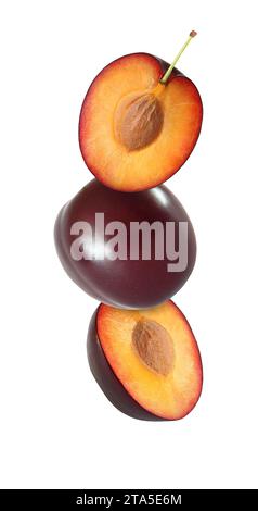hanging, falling, soaring and flying whole and sliced plum isolated on white background with clipping path Stock Photo