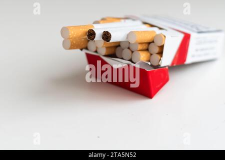 Heap of cigarettes. Isolated on a white background. Stock Photo