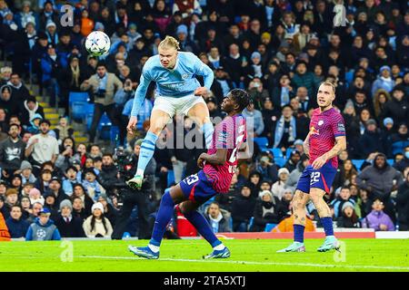 Manchester, UK. 29th Nov, 2023. Erling Haland of Manchester City heads in during the Manchester City FC v RB Leipzig FC UEFA Champions League Round 1 Group G match at Etihad Stadium, Manchester, England, United Kingdom on 28 November 2023 Credit: Every Second Media/Alamy Live News Stock Photo