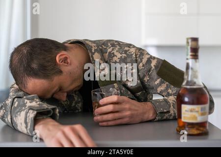 Portrait of middle aged sad, desperate military man. Disabled soldier suffering from depression psychological trauma. PTSD concept. Stock Photo