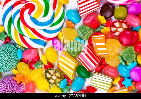 Colorful lollipops and different colored round candy. Top view. Stock Photo