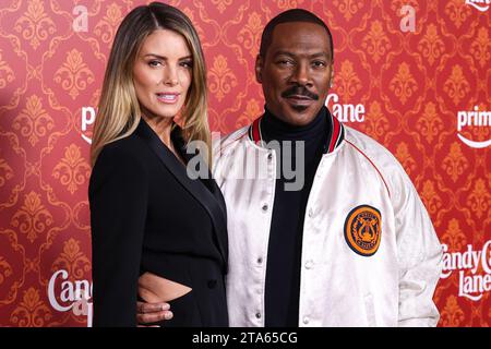 Westwood, United States. 28th Nov, 2023. WESTWOOD, LOS ANGELES, CALIFORNIA, USA - NOVEMBER 28: Australian actress Paige Butcher and fiancé/American actor and comedian Eddie Murphy arrive at the World Premiere Of Amazon Prime Video's 'Candy Cane Lane' held at the Regency Village Theatre on November 28, 2023 in Westwood, Los Angeles, California, United States. (Photo by Xavier Collin/Image Press Agency) Credit: Image Press Agency/Alamy Live News Stock Photo