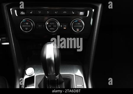 Gear lever and black climate control panel of a modern car. Close up photo with selective focus Stock Photo