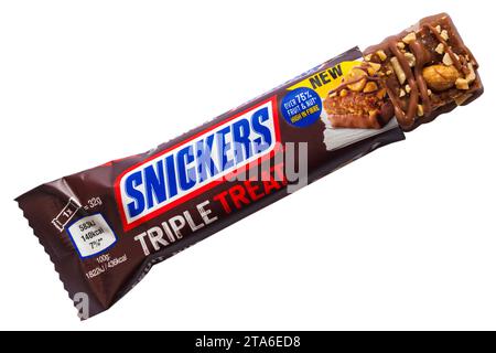 Snickers Triple Treat Fruit, Nut & Chocolate date raisin and peanut bar topped with peanuts, dipped and drizzled with milk chocolate isolated on white Stock Photo