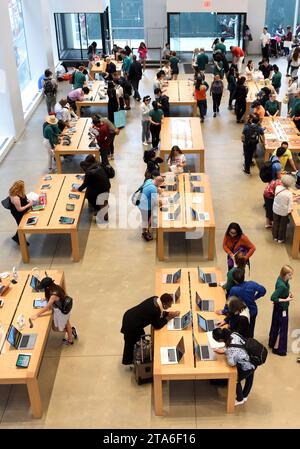 New York, USA - June 08, 2018: People in store Apple Fifth Avenue in New York, NY. Stock Photo