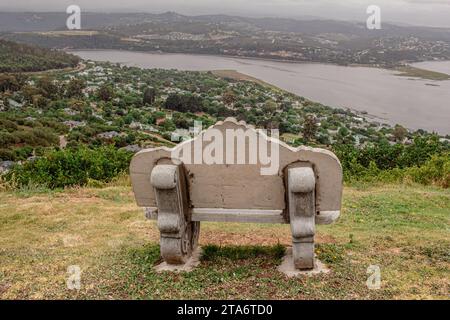 Lonely concrete bench overlooking river near Knysna, South Africa Stock Photo