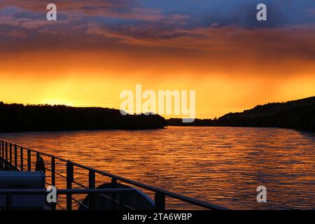 Magnificent sunset on Danube seen from a river cruise ship near Vukovar, eastern Slavonia region,at the border between Croatia (left) & Serbia (right) Stock Photo