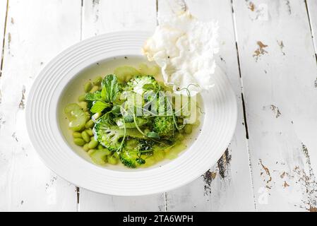 vegetable soup with broccoli and beans on a white wooden background. High quality photo Stock Photo