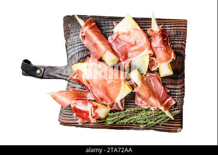 Prosciutto ham with slices of melon and fresh thyme. Isolated, white background Stock Photo