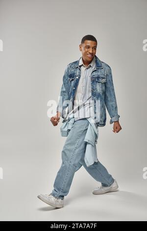 Trendy African American Man In Black Sweater And Beret Showing Finger 