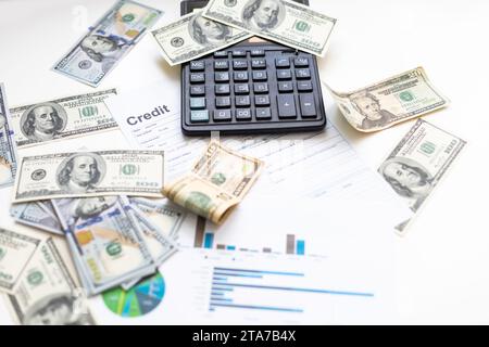 business graph chart paper pen calculator us dollar on office desk. Checking financial reports. Stock Photo