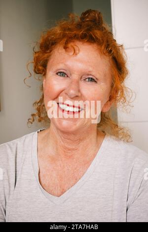 Portrait of smiling senior woman at home Stock Photo