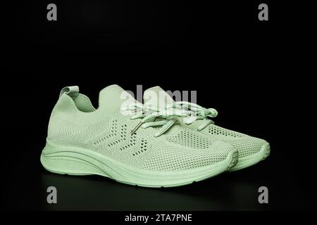 green mesh sneaker, side view, summer shoes, on a white background, isolated Stock Photo