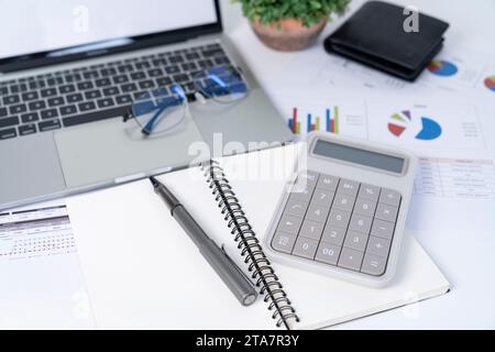 The calculator placed on the working desk. Stock Photo