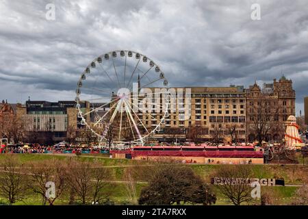 Edinburgh Scotland Christmas Fair or Market Princes Street stalls crowds Big Wheel and the Helter Skelter Stock Photo