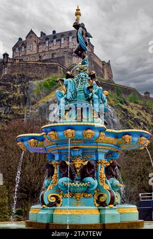 Edinburgh Scotland the castle rock and colourful fountain in early winter Stock Photo