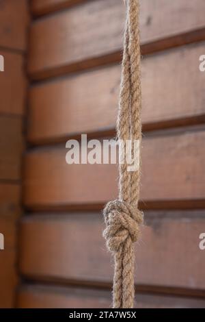 Bow knot made of linen rope string isolated over the background. Stock Photo