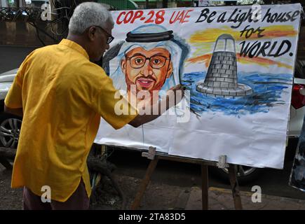 Mumbai, Maharashtra, India. 29th Nov, 2023. A teacher from Gurukul school of art seen painting amid the welcoming of the Conference of the Parties of the UNFCCC (COP 28) in Mumbai. Conference of the Parties of the UNFCCC (COP 28) will be held from 30th November to 12 December 2023 at Expo City Dubai in United Arab Emirates (UAE) to tackle the global challenge of climate change. (Credit Image: © Ashish Vaishnav/SOPA Images via ZUMA Press Wire) EDITORIAL USAGE ONLY! Not for Commercial USAGE! Stock Photo