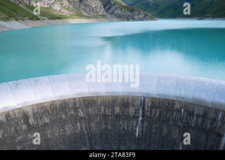 Spillway of Moiry Dam and turquoise water of Lac de Moiry, at the head of the Grimentz Valley, Switzerland. Stock Photo