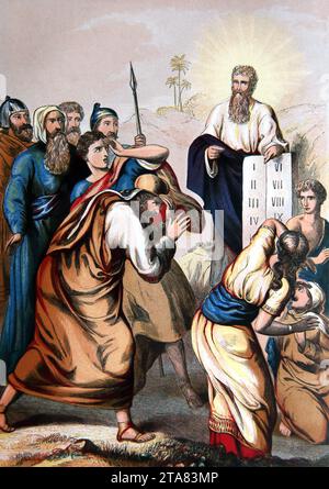 Illustration of Moses Presenting the Ten Commandments ( Exodus) Old Testament from the Altar of the Household Bible Stock Photo