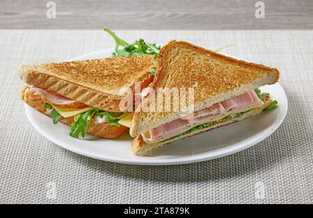 plate of ham and cheese toast on restaurant table Stock Photo