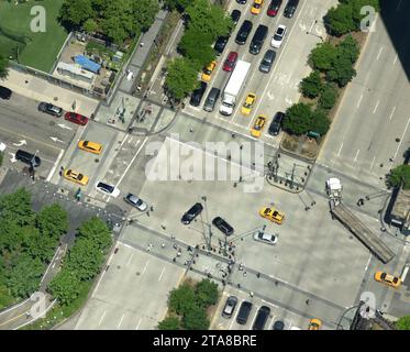 View from skyscrapers on the streets of New York City. Top view on the street with cars on the road Stock Photo