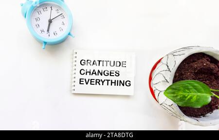 Gratitude changes everything. The text label in the notebook. Expression of politeness, satisfaction, positive assessment of events. Stock Photo