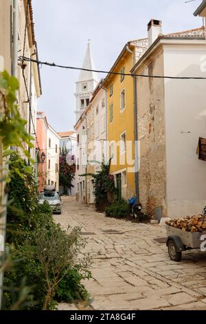 View of cobbled alley leading to St.Martins Church in Vrsar (Orsera), Istria, Croatia, Europe. Stock Photo